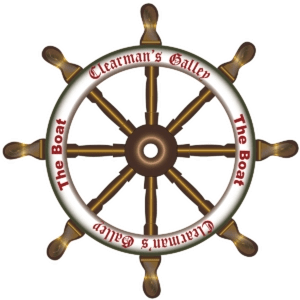 A decorative boat steering wheel with the text 'Clearman's Galley' and 'The Boat' inscribed around it.