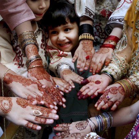 Muslims girls display their hands painted with traditional henna to celebrate Eid al-Fitr holidays, marking on the end of the fasting month of Ramadan, in Peshawar, Pakistan.CREDIT:AP