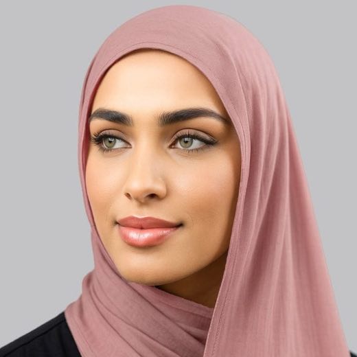 A woman comfortably wearing a modal hijab, highlighting the fabric's fluid drape. Clothifydotpk