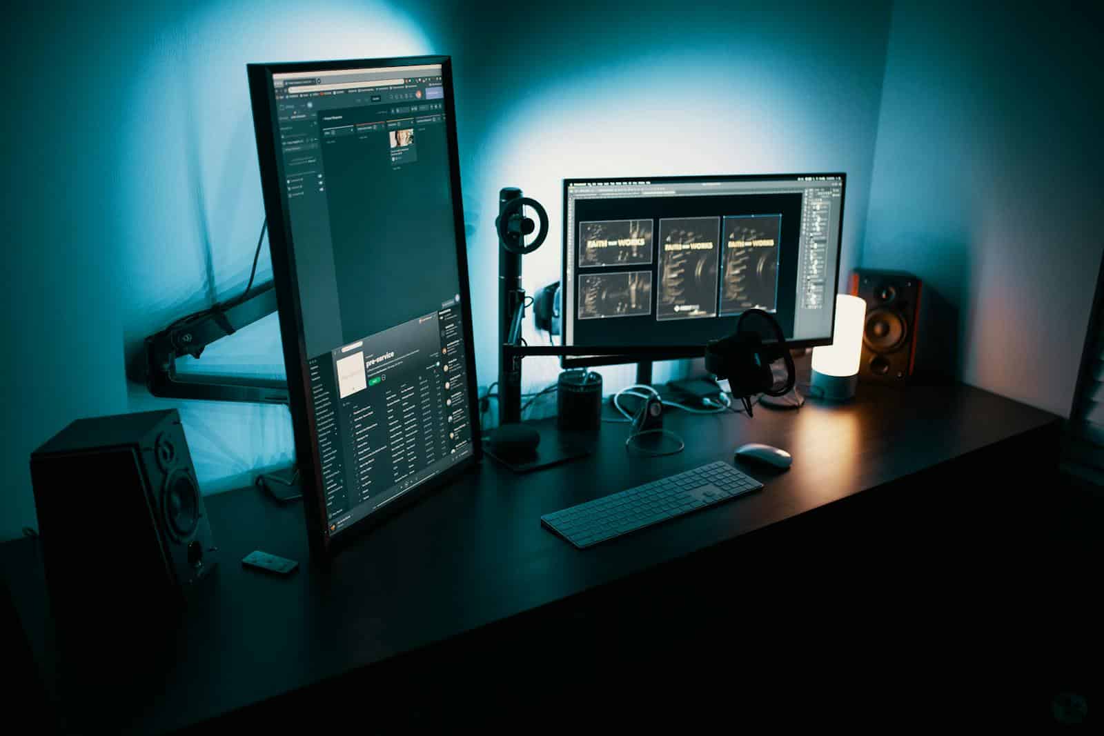 A contemporary office desk featuring a dual monitor setup with stylish lighting, ideal for tech enthusiasts showing the use of cloud build technologies and techy apps and devops .