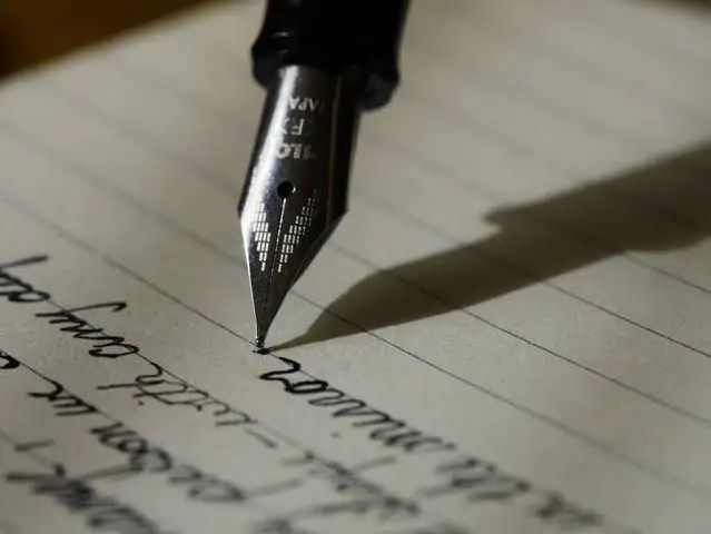 A pen of black colour writing on a white paper