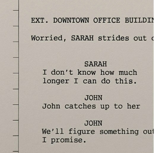 A close-up of a screenplay page with vertical tick marks every inch along the margin, dividing the page into eight segments.