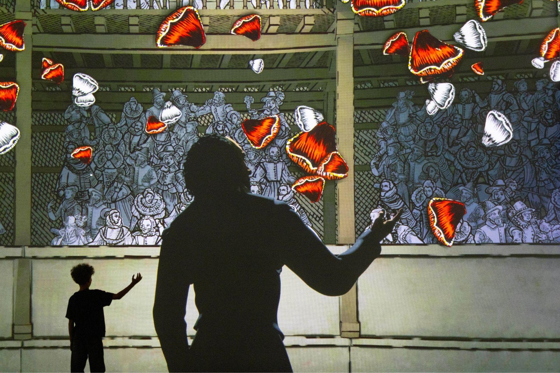 Young boy looking at an image of Shakespeare in Stories - Brought to Life at FRAMELESS