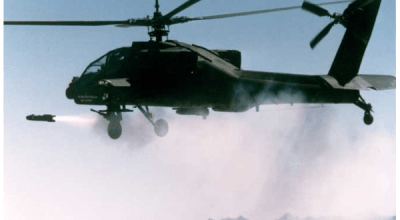 An AH-64 Apache unleashes a Hellfire missile with pinpoint accuracy, demonstrating its lethal versatility in countering certain airborne threats on the modern battlefield.