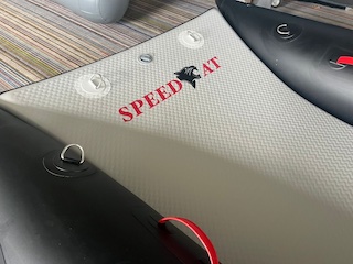 Rebel Speedcat, ultimate inflatable design that fuses speed and fun into a lightweight, compact package. With our extensive experience in racing Zapcats and RIB design, we've crafted a pleasure craft that features built-in speed tubes and an optional clip in forward water tank for optimal performance and safety. Enjoy ultra stability and versatility with two clip-in seats, making it perfect for fishing or family adventures. For the best experience, pair your Speedcat with a Tohatsu engine, renowned for its performance and reliability.
