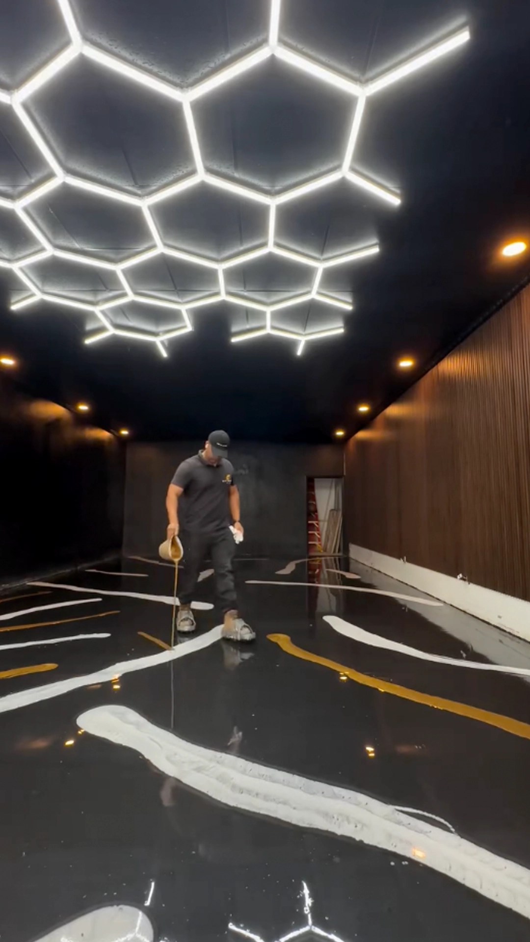 LED honeycomb lighting in luxury garage with epoxy flooring