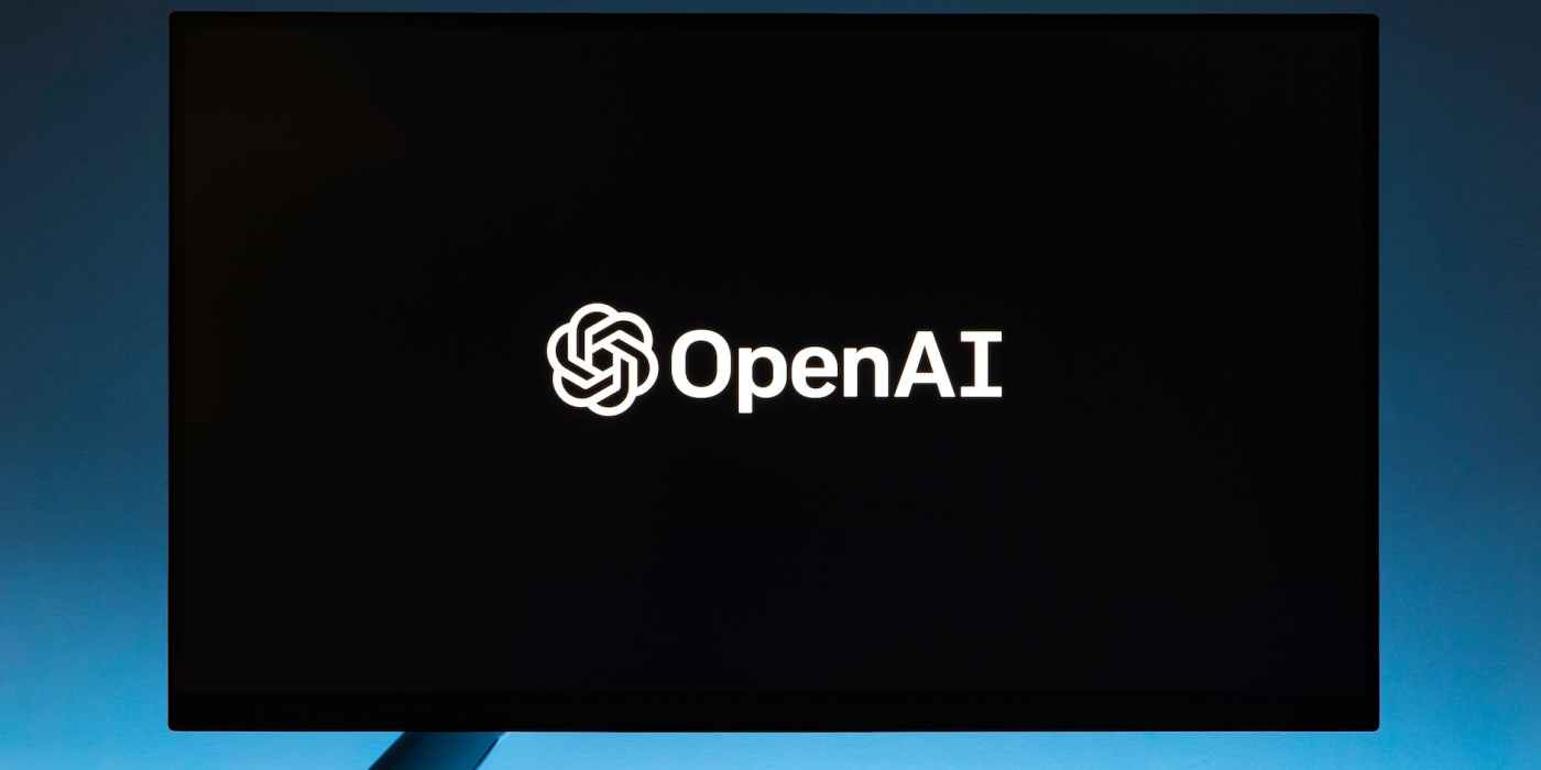 monitor screen with openai logo on black background
