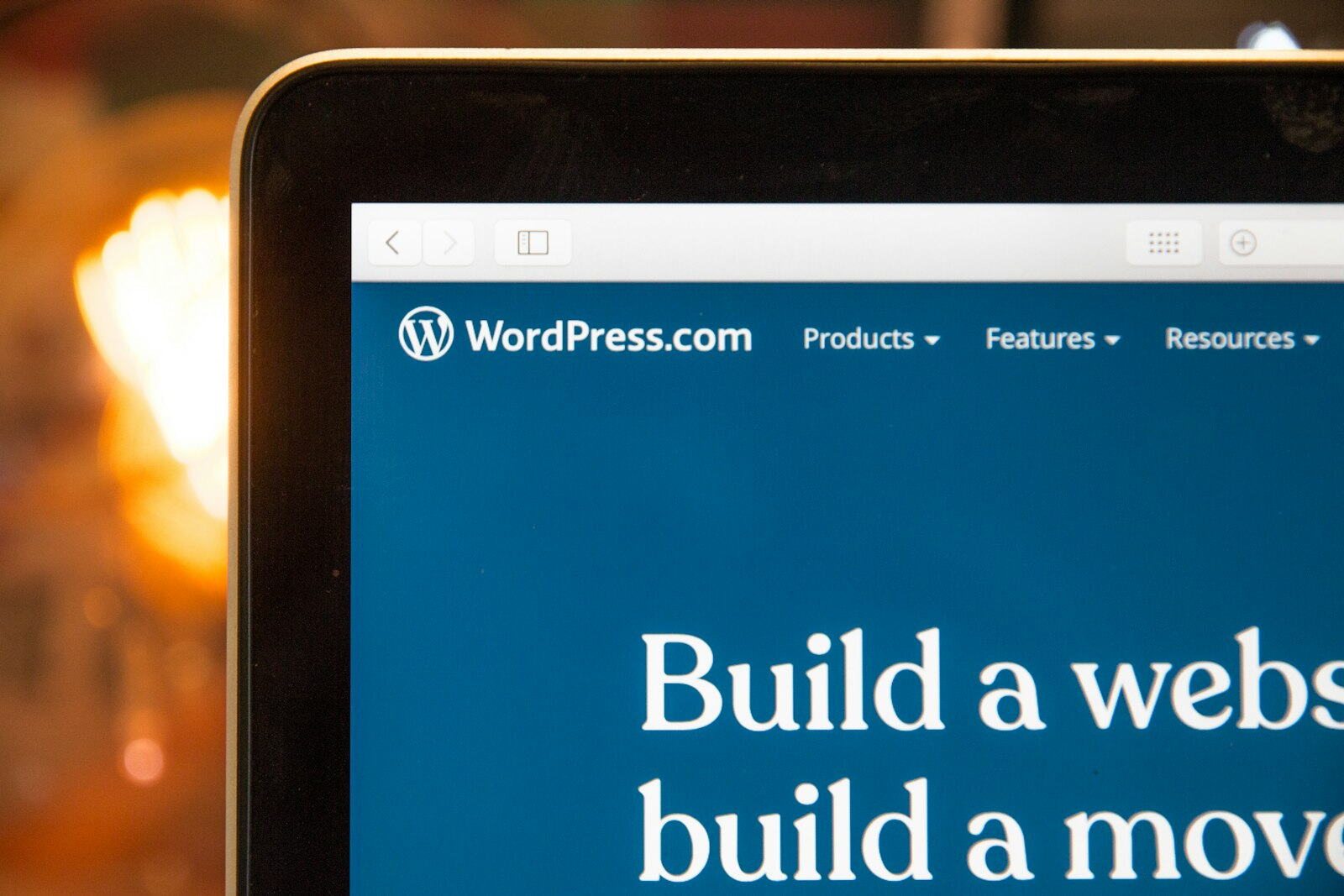 A monitor showing a WordPress site on a desk