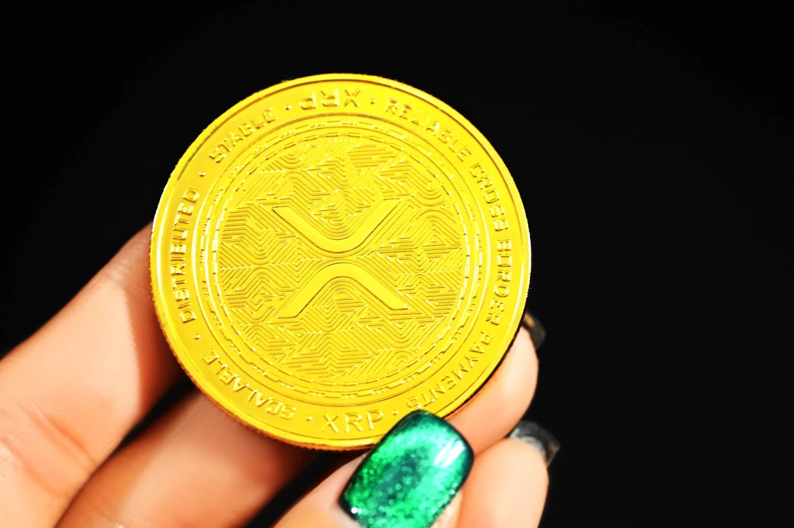 Woman's Hand Holding XRP Token