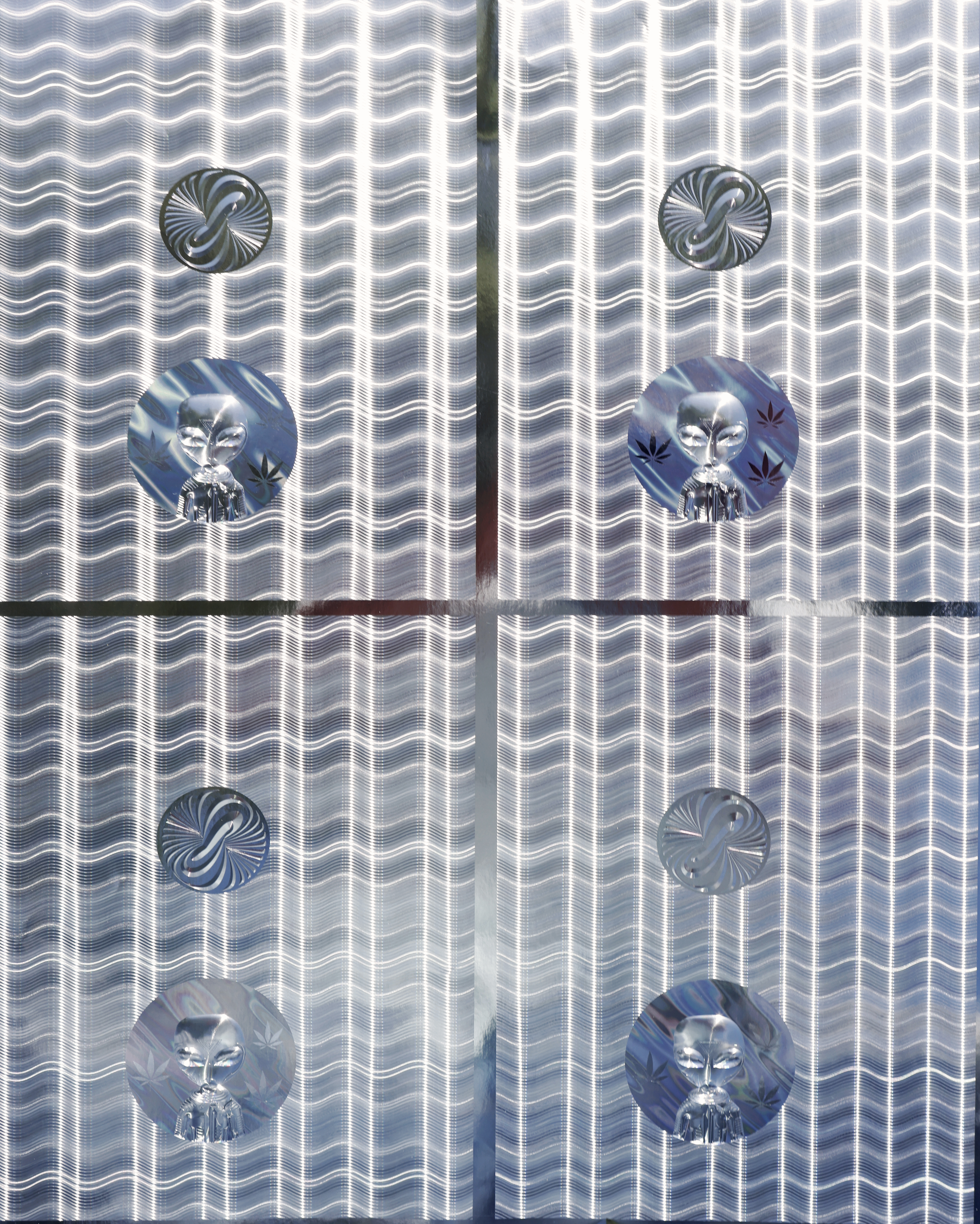 Registered hologram before overprint