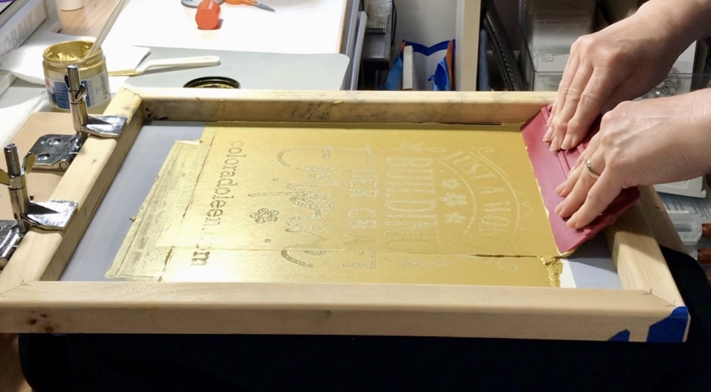 Photo of the screen flooded with Opaque Gold Speedball Fabric Ink used in today’s How I Screen Printed My Craft Empire Shirt post.