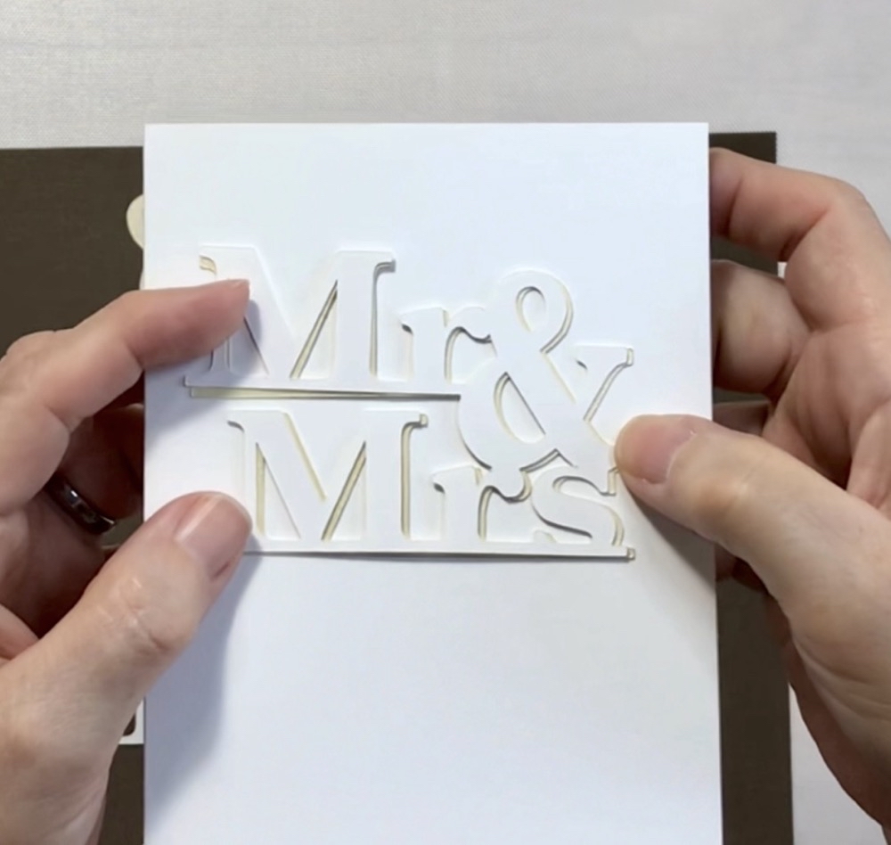 Photo showing the how the card would look with the first paper choice, Recollections shimmer card in Champagne. 