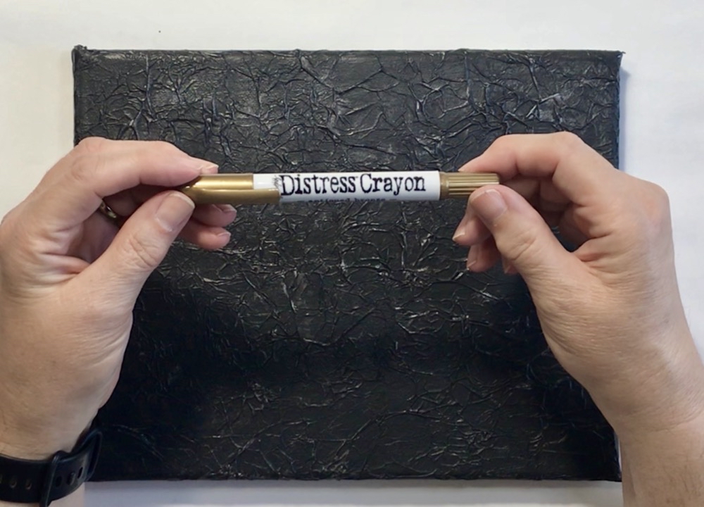 Photo featuring the Antique Bronze Distress Crayon by Tim Holtz used to enhance the front of the canvas for today's How to Make an Exploding Busted Canvas post.