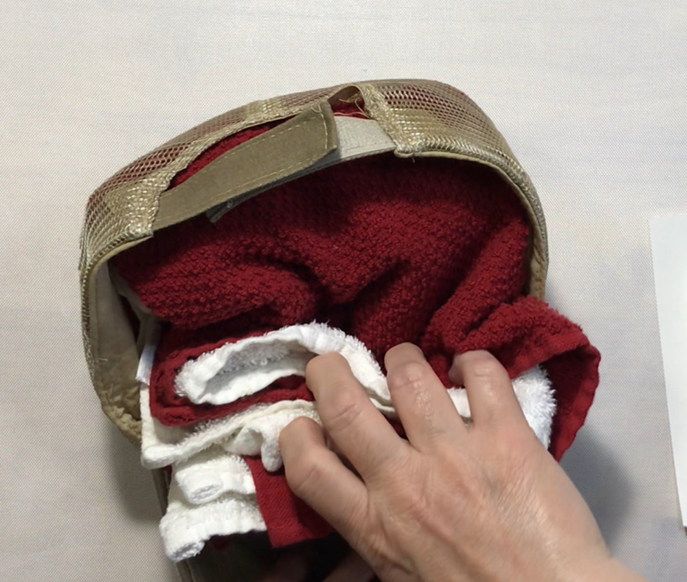 Screen shot showing how I stuffed two hand towels into the hat to give it stability.