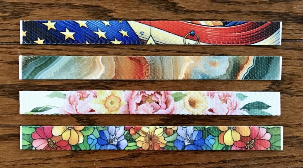 Photo of the fronts of the first 4 sublimated Wristlet Keychains