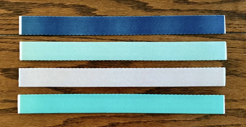 Photos of the matching backs of the first 4 wristlet keychains