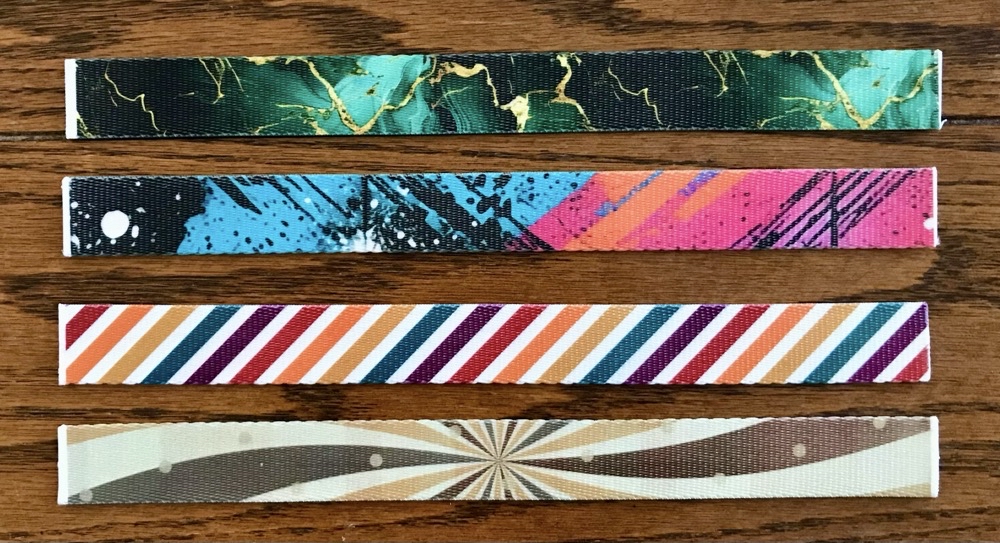 Photo of the fronts of four more of the wristlet keychains made in today's post.