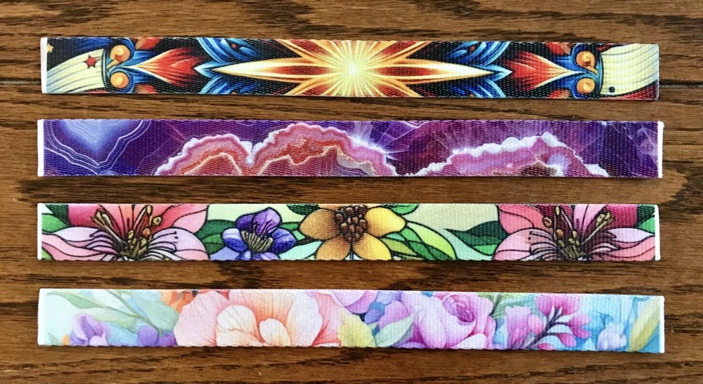 Photo of the fronts on the last four sublimated wristlet keychain fronts made for today's post and video.