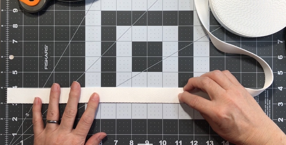 Photo showing the width of the polyester webbing as well as the 11" I intend to cut for east keychain.