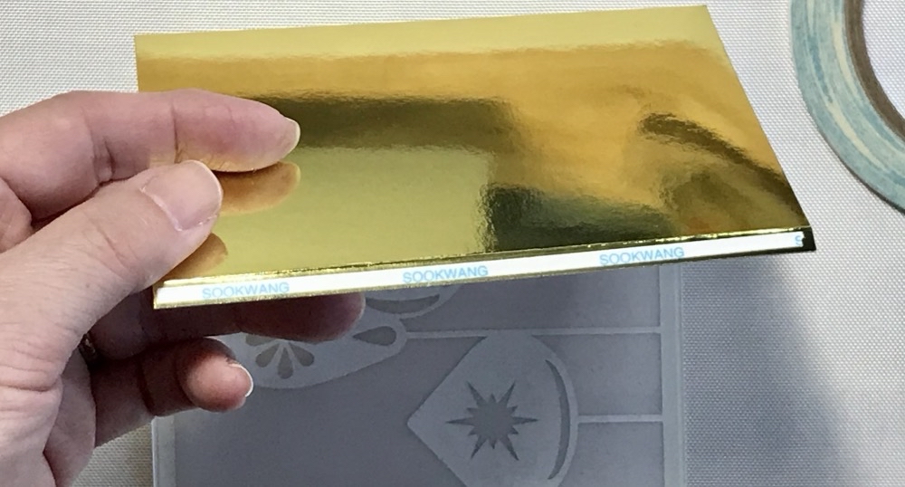 Photo showing the 1/8" piece of scor-tape used on the tab to close the lantern.