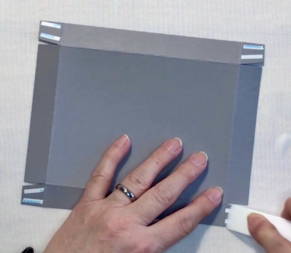 Photo showing the two pieces of scor-tape that I use on all of the flaps to secure the box.