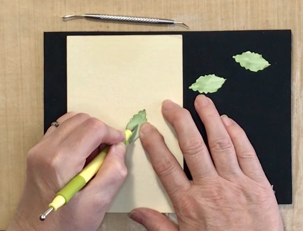 Photo showing how to use a 1mm stylist to add in the stem line down the center of the petal for today's Christmas Rose Card for a Holiday Birthday project.