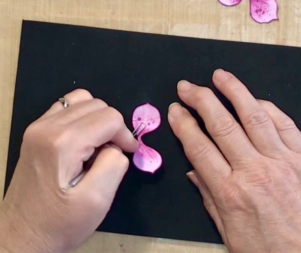 Photo showing the use of the loop tool to gently soften and start the shaping process.