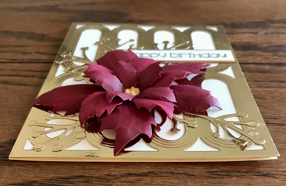 Side view of the finished card showing the approximate height of the poinsettia flower.