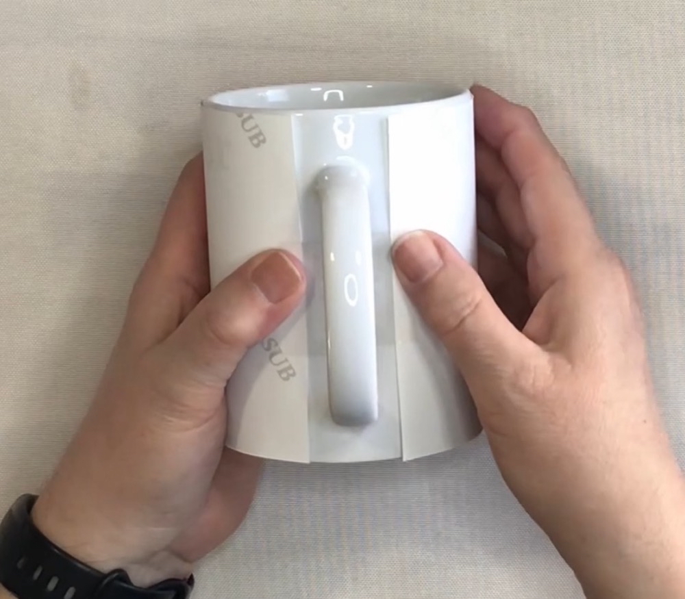 Photo showing the proper placement of the image, approximately .5" on either side of the handle to ensure proper placement of the finished design.