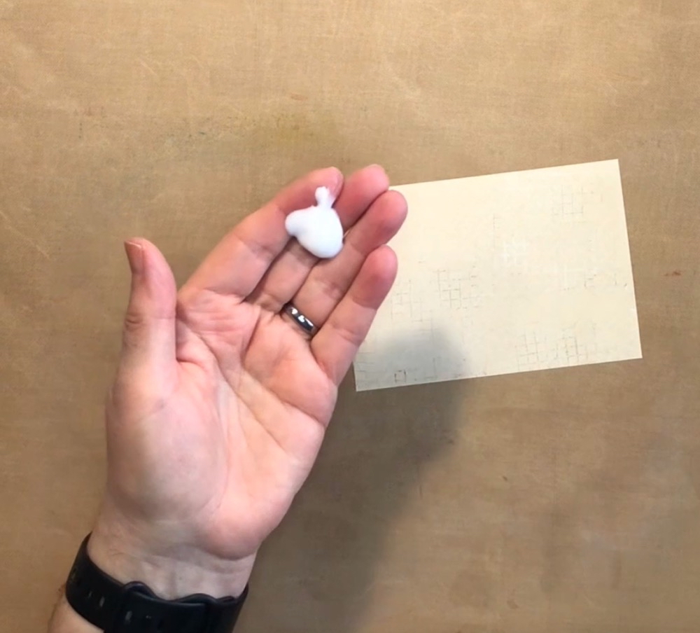 Photo showing how much Nivea Body Lotion I used on each sheet of paper for today's How to Create Textured Paper with Mamigami post.