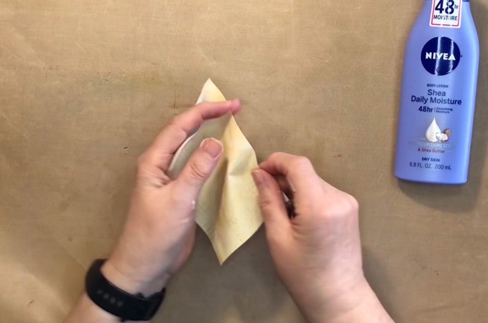 Photo showing how I began to gently crumple the paper after appling the lotion for today's How to Create Textured Paper with Mamigami project.