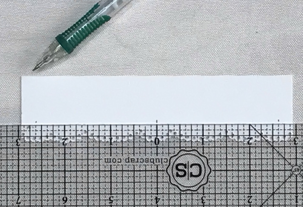 Photo showing the marks on the back of the valance to cut it to size.