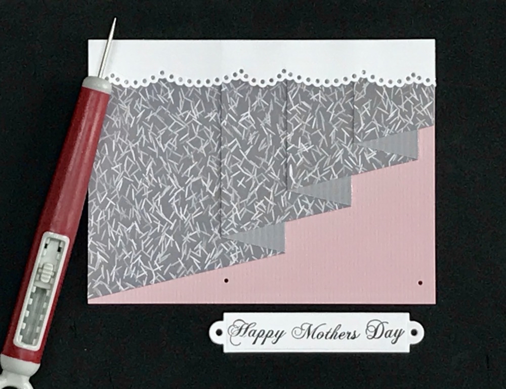 Photo showing the Tim Holtz craft pick used to make the holes needed to use mini brads on the card fron of today's How to Make a Curtain Fold Card project.