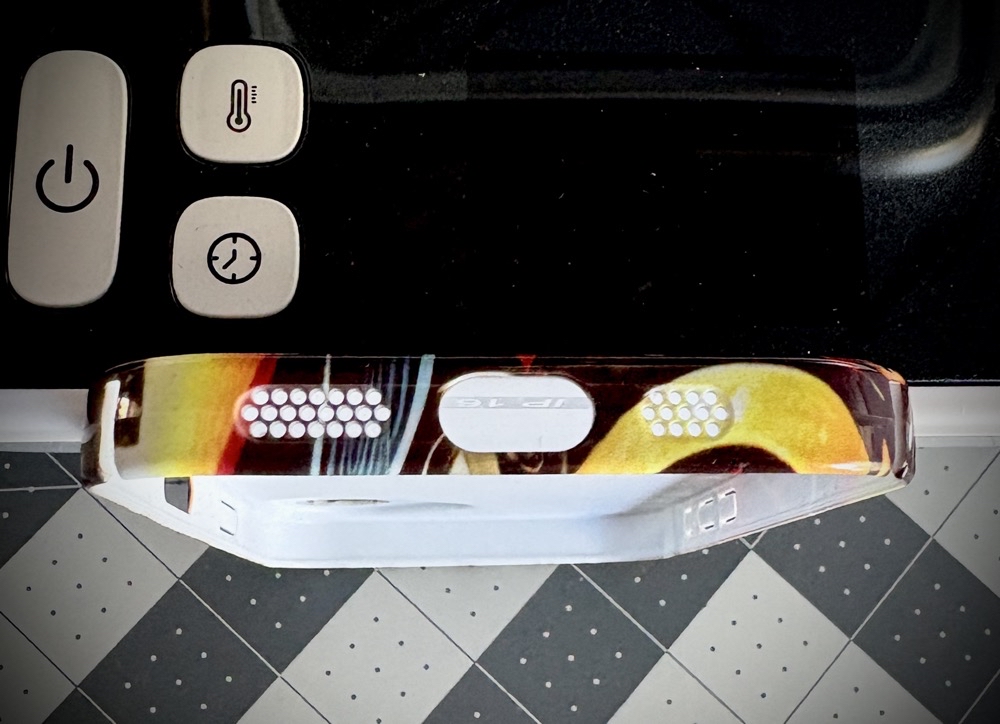 Close-up photo of the bottom of the finished phone case showing the edge to edge sublimation with the phone case heat press.