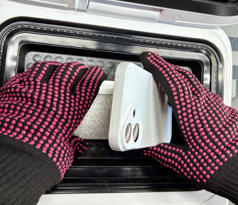 The best way to place the phone case on the fixture #2 - hook the bottom of the case to the bottom of the fixture and push the fixture together.