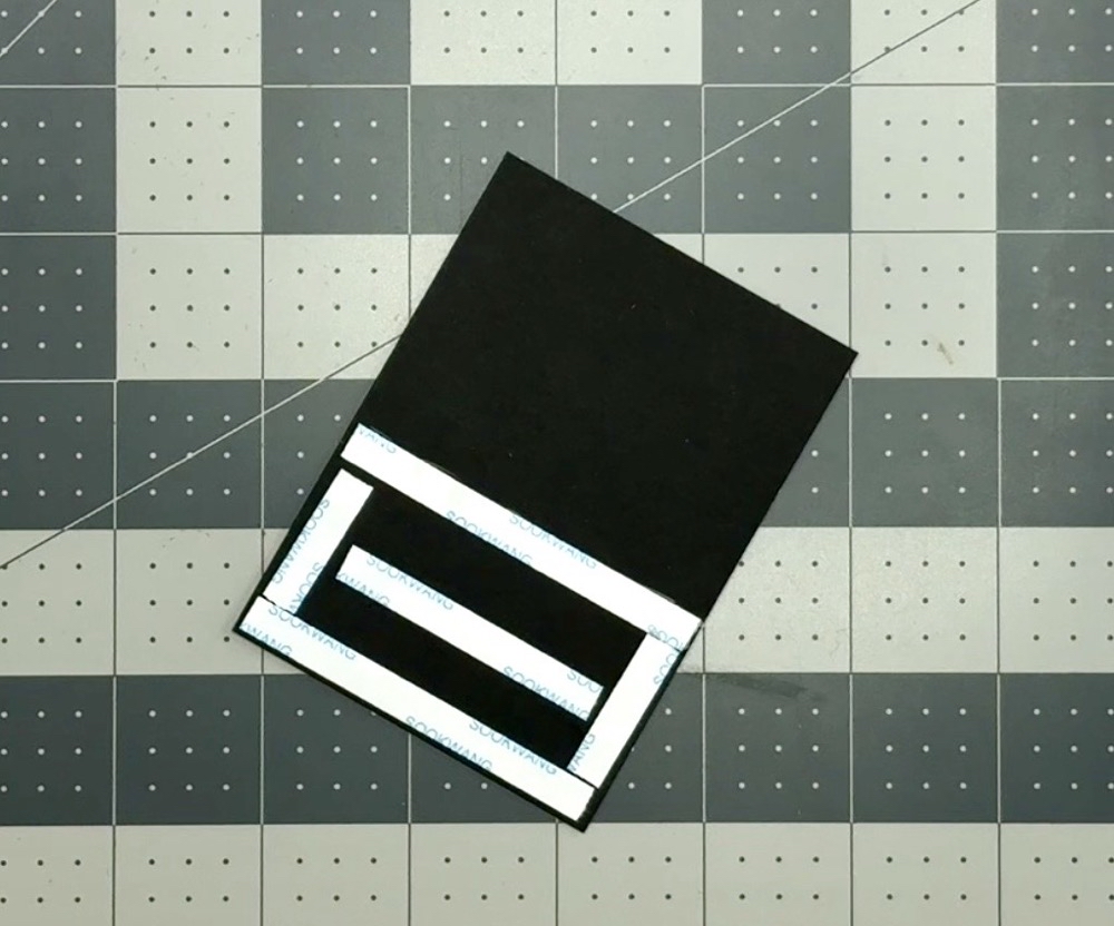 Photo showing the amount of adhesive added to the back of the front panel for the fun fold card for today's 6x6 One Sheet Wonder with a Fun Fold Card project.