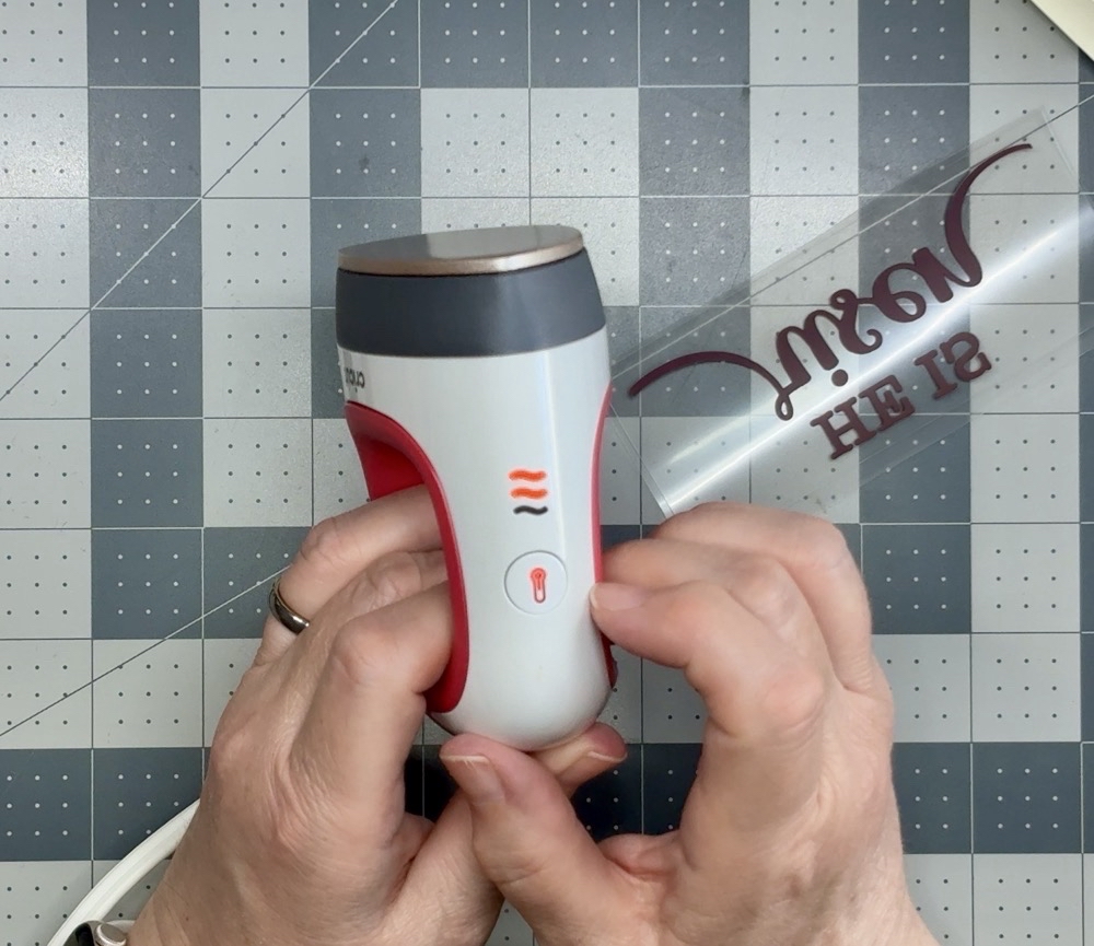Screen shot showing the Cricut Mini EasyPress turned on to the medium heat setting for todayโs project. The press will show a red light while it is heating to proper temperature.