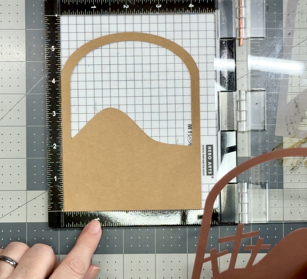 Photo showing how I use the My Sweet Petunia Mini Misti Stamping tool to help line up the layers of todayโs project.