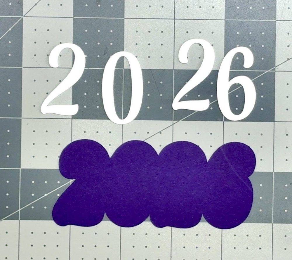 Screen shot showing the two layers of the year 2026 for today’s card project with the numbers cut from 110lb white card and the mat cut from the inked 65lb card.