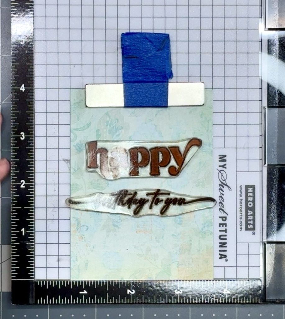 Screen shot showing the alignment of the sentiment stamps onto the pattern paper for today’s How to Make a Diagonal Joy Fold Card: Easy Step-by-Step Tutorial project.