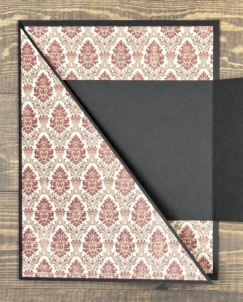Photo showing the open Horizontal Joy Fold card featuring pattern paper from the Paper Studio.