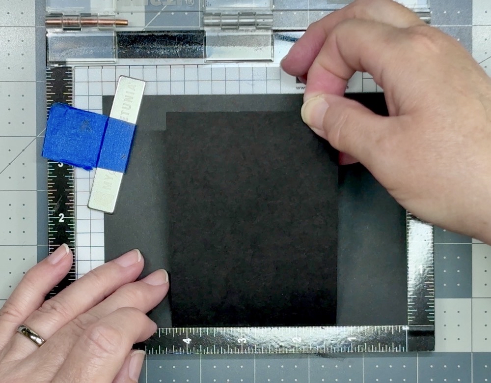 Screen shot showing the use of the My Sweet Petunia Mini Misti to assist in placing the front flap in the correct location on the card base.