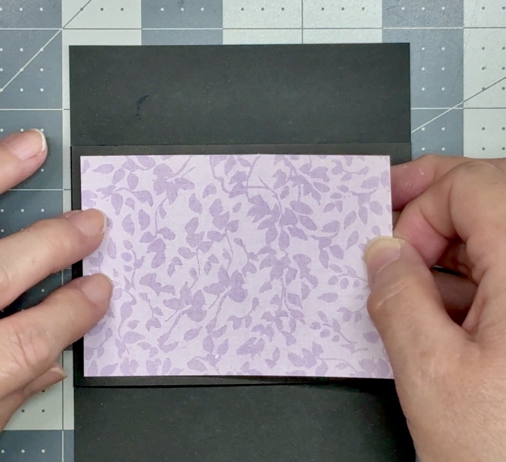 Screen showing the application of the pattern paper to the front panel of our card.