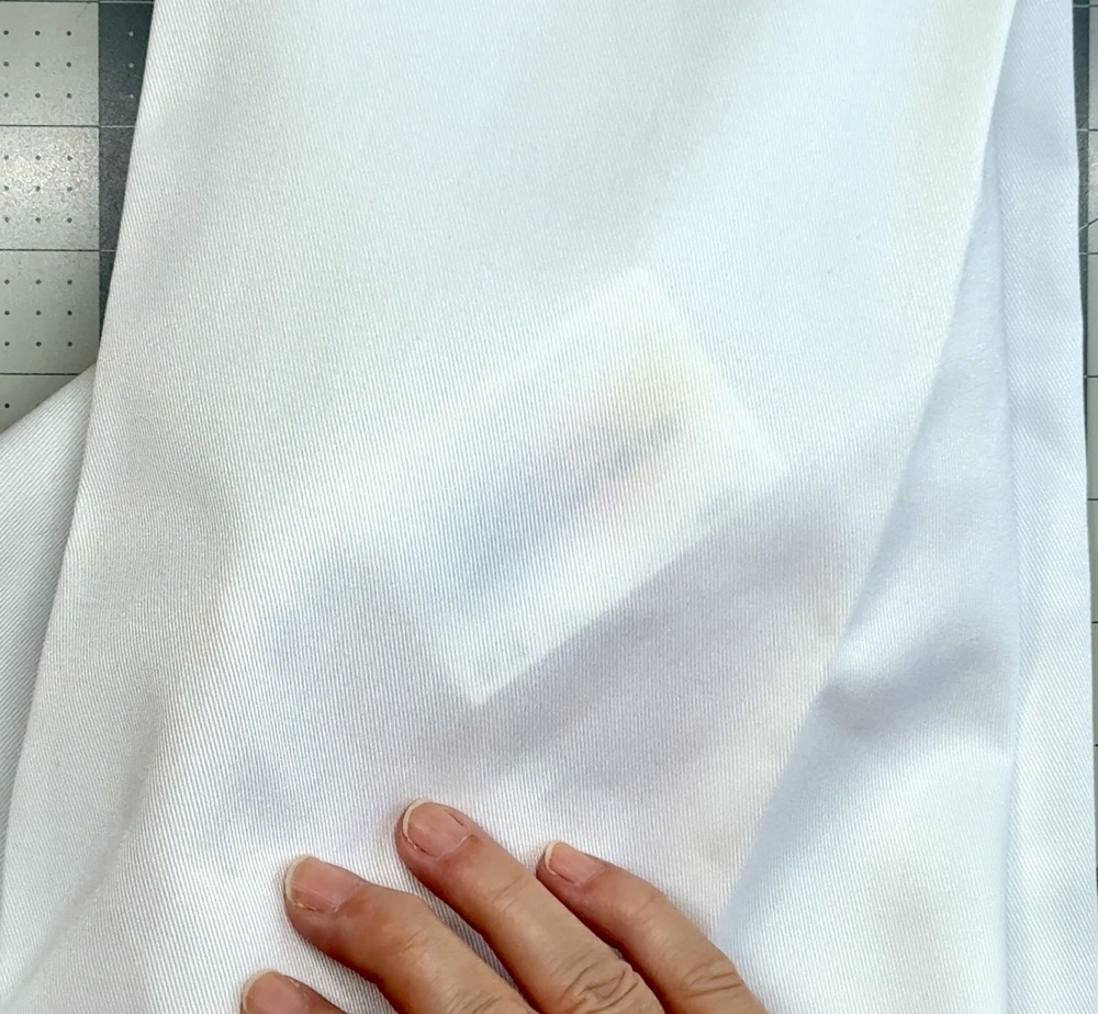 Photo showing how thin and see through the smooth kitchen towel from Hobby Lobby is.
