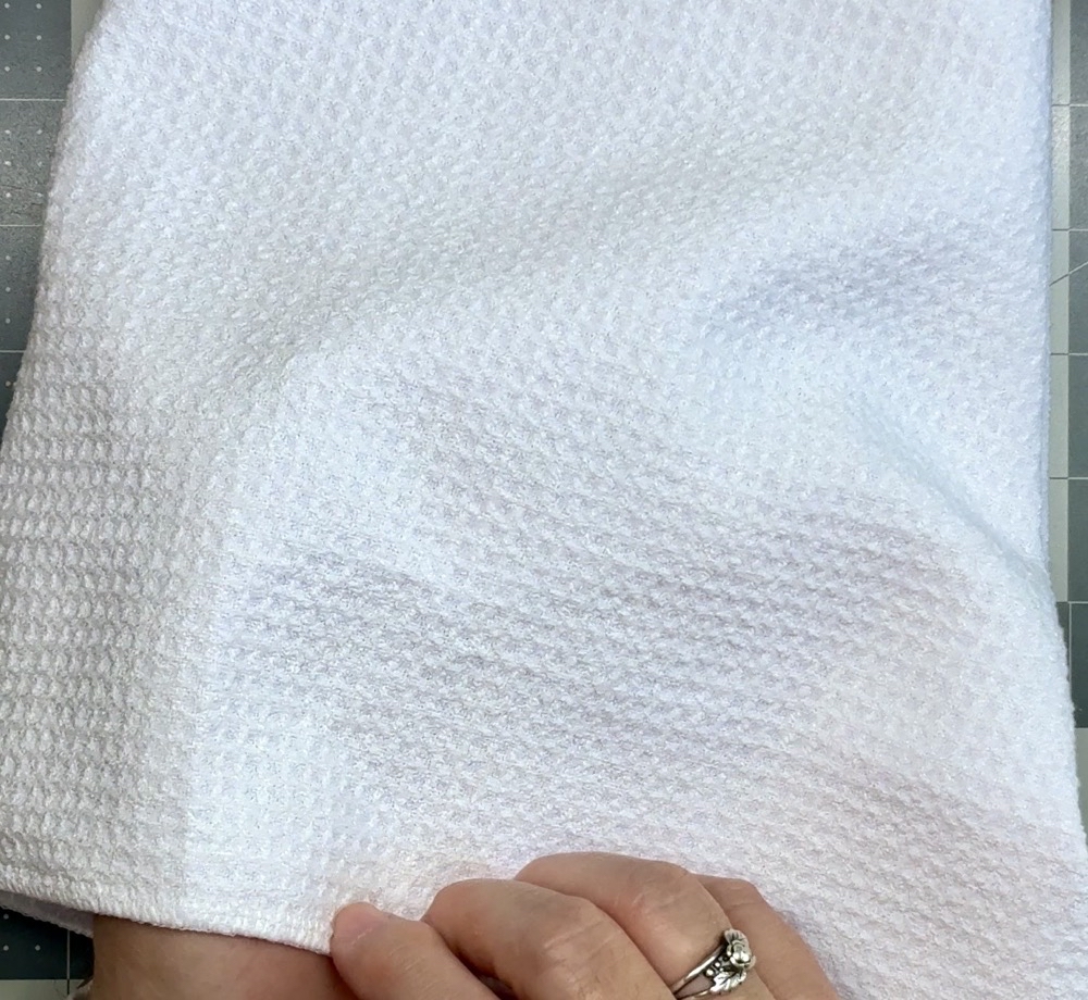 Photo showing how thick the Make Market kitchen towel is.