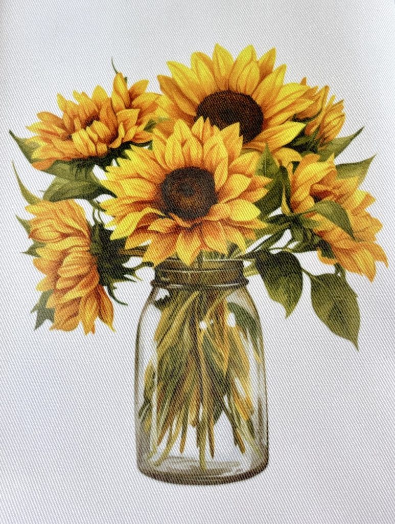 Photo showing the finished sublimated smooth kitchen towel from Hobby Lobby showing a pretty, but not as bright of an image as it could be. 