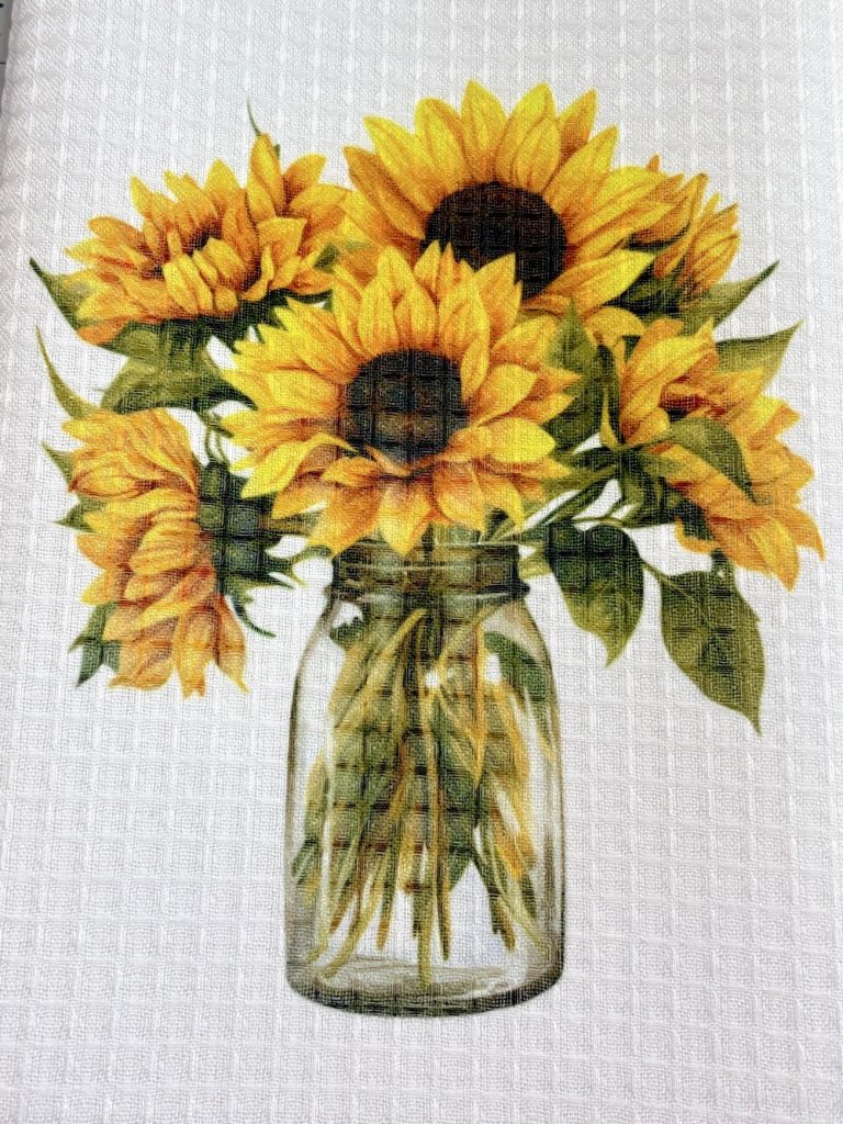 Photo of the finished waffle weave kitchen towel from Hobby Lobby clearly showing the waffle pattern in the finished design.