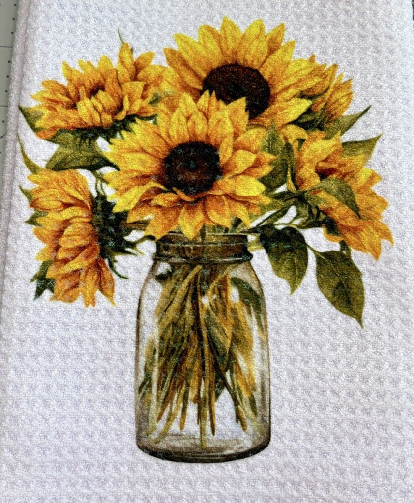 Photo of the finished Make Market by Michael’s  waffle weave kitchen towel and how vibrant and bright the sublimated image is.