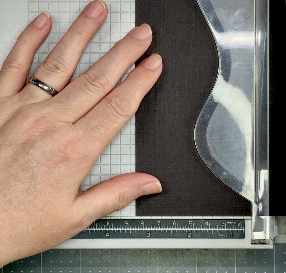 Screen shot showing cutting down the black linen-textured card stock to 3 3/8” wide.