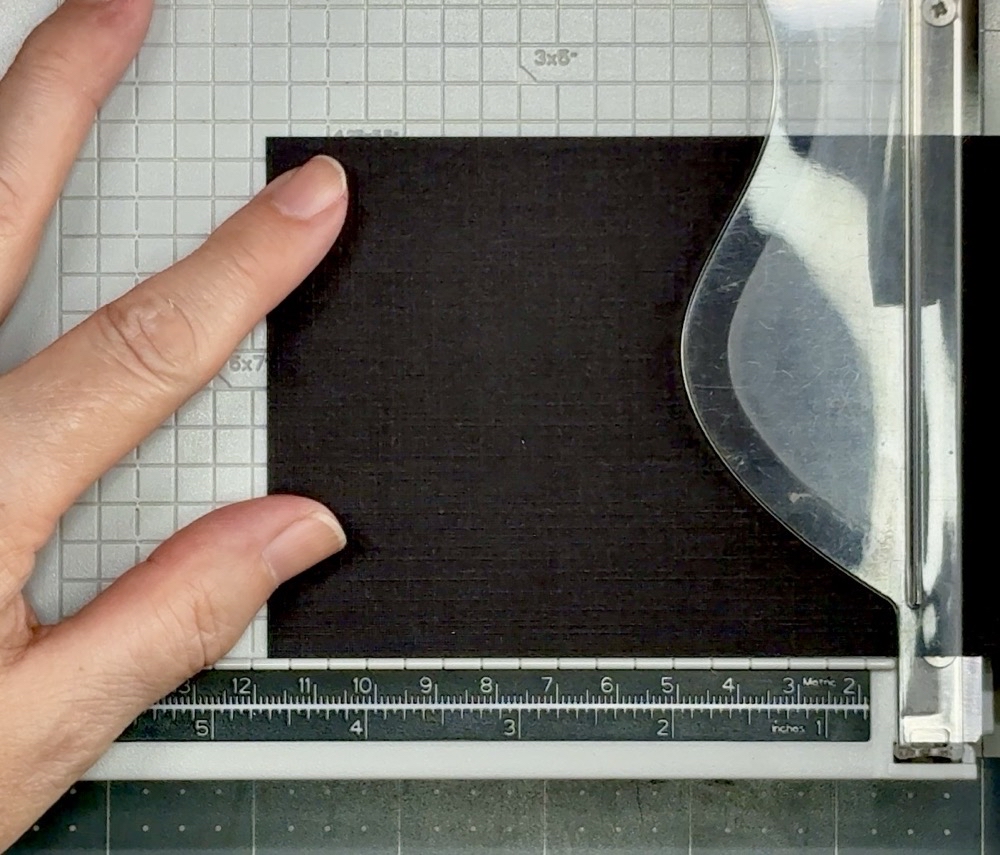 Screen shot showing cutting the linen-textured card stock being cut down to 4 5/8” for the alcohol ink background mat.